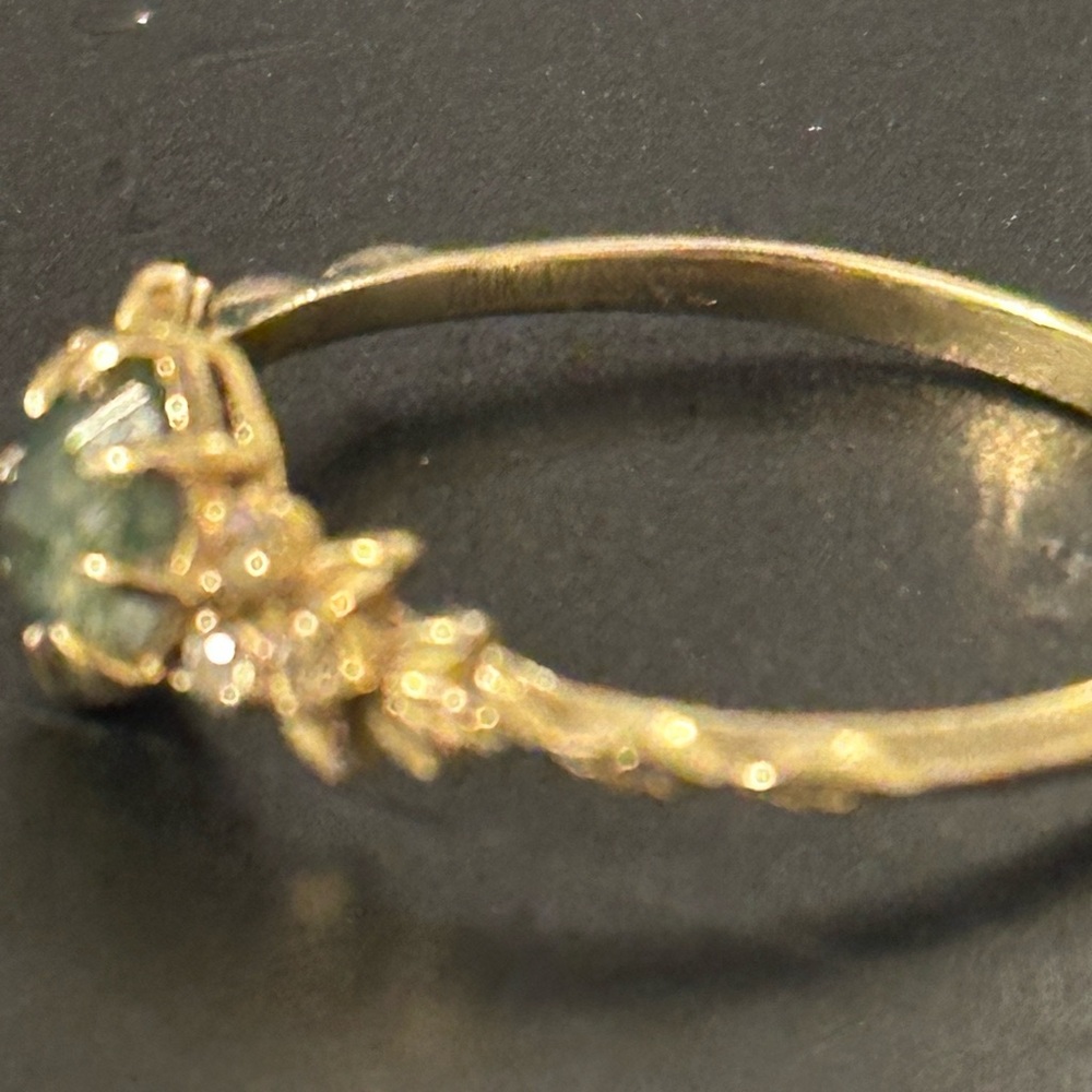 Intricate Gold Ring with Green Stone